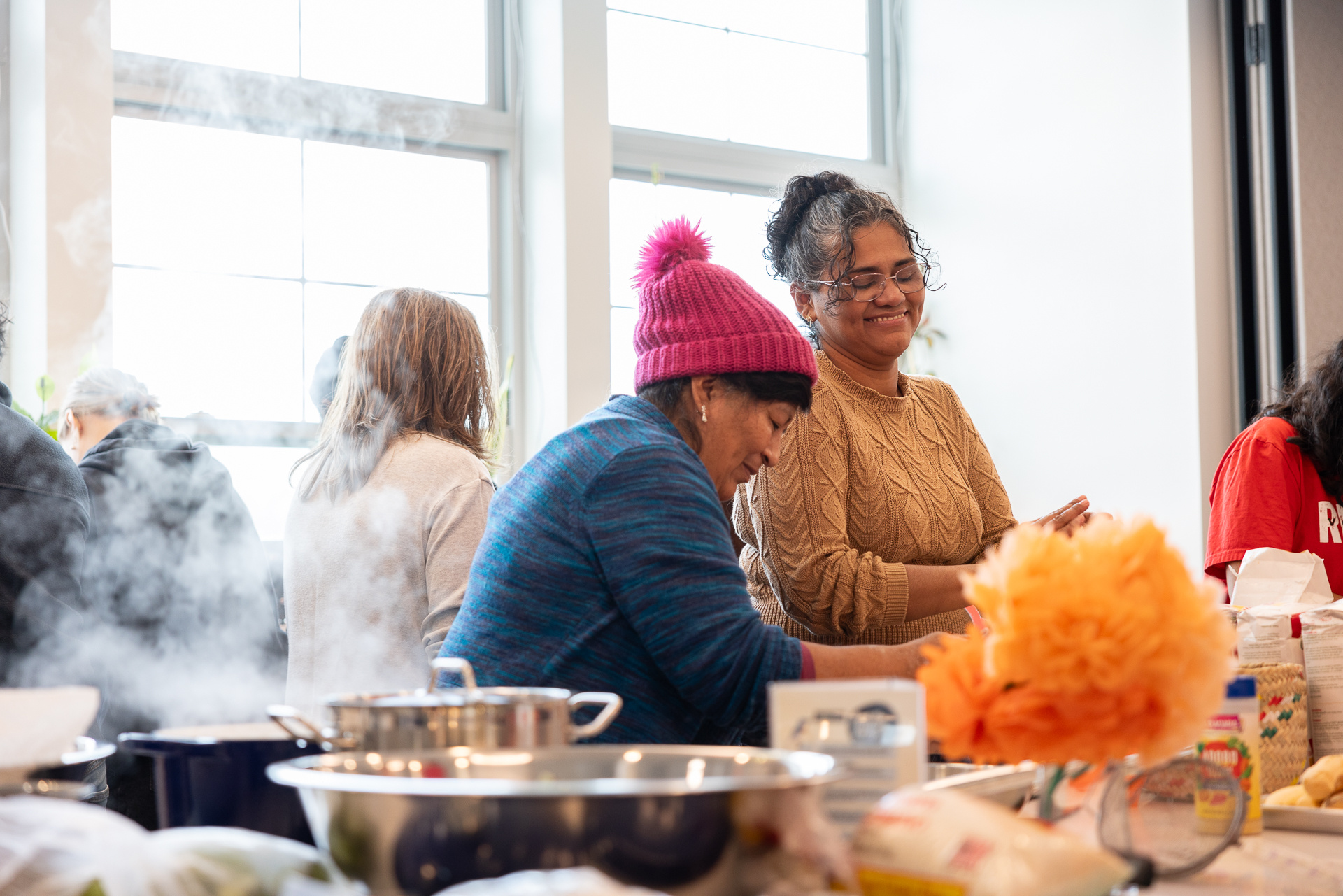 Two women in a kitchen working 